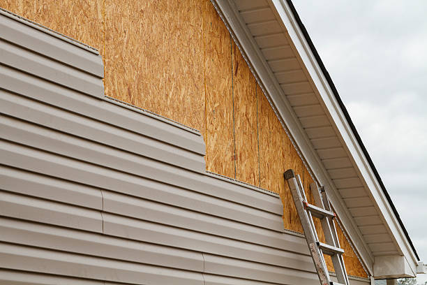 Professional Siding Contractor technician working in Williston Park, NY